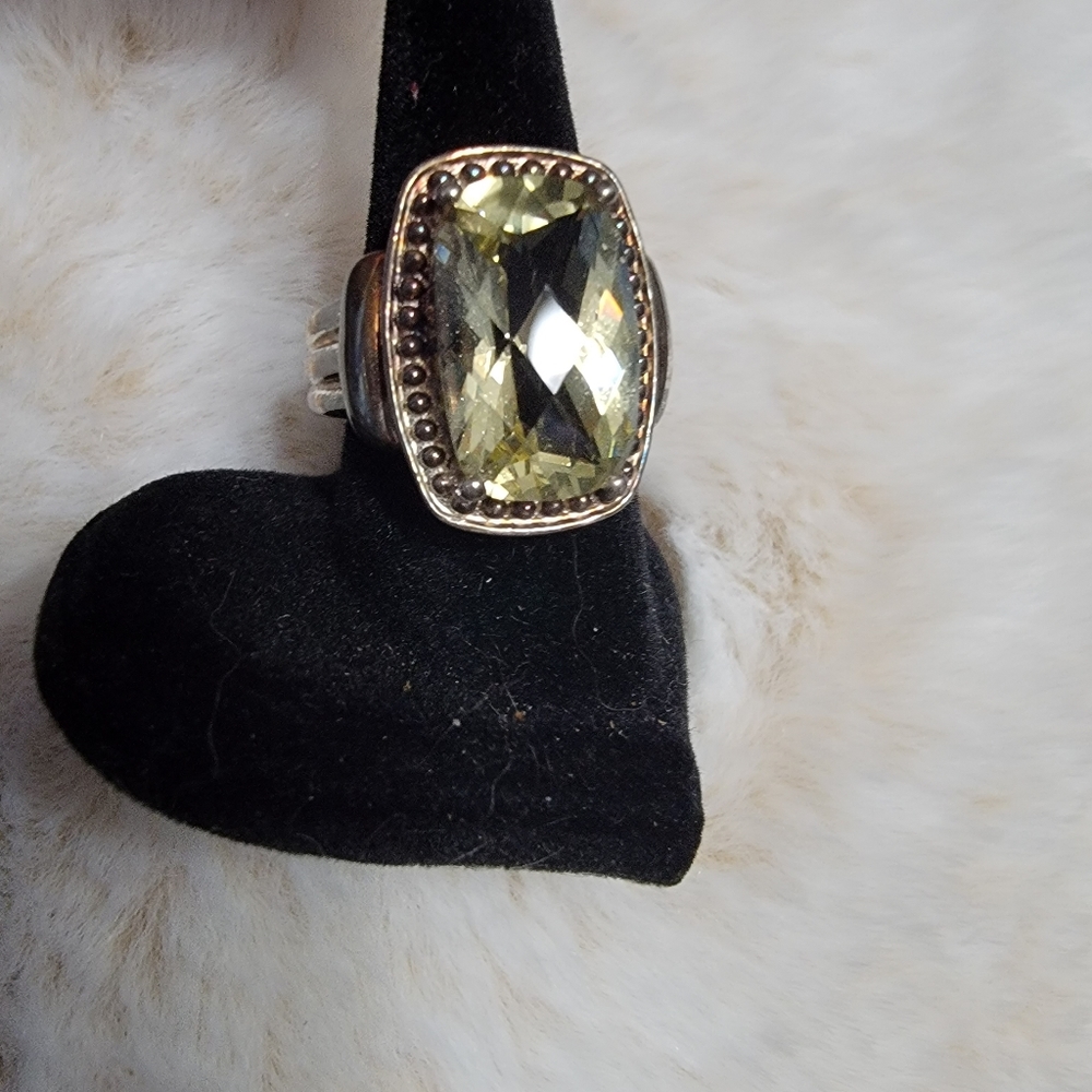Beautiful multi-faceted citrine ring.  3/4 inch main stone in SS.  Size 8